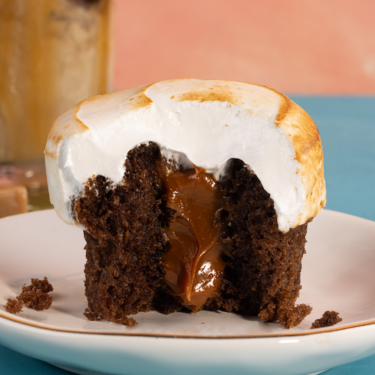 bite shot of a caramel macchiato cupcake. not-bg