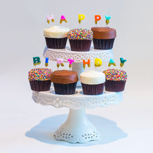 Load image into Gallery viewer, Sprinkle best selling cupcakes on cake standed with &#39;Happy Birthday&#39; gold glitter dipped candles. not-bg
