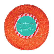 Load image into Gallery viewer, Top view of candy apple cupcake not-bg
