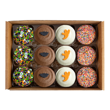 Load image into Gallery viewer, overhead shot of Halloween-themed cupcakes with various decorations not-bg

