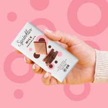 Load image into Gallery viewer, Milk chocolate bar pink background with hand. not-bg
