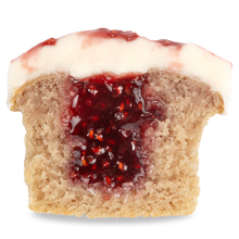 Load image into Gallery viewer, inside view of a white chocolate raspberry cupcake. not-bg
