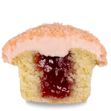 Load image into Gallery viewer, side view of strawberry shortcake cupcake with strawberry jam filling not-bg
