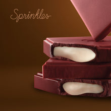 Load image into Gallery viewer, Red Velvet chocolate bar close up shot. not-bg
