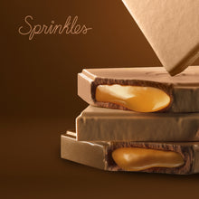Load image into Gallery viewer, Salted caramel chocolate bar close up. not-bg
