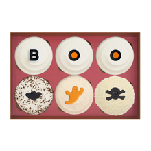 Load image into Gallery viewer, Boo Box 6 count with 3 red velvet with boo decorations, 1 black &amp; white with a bat decoration, 1 pumpkin with a ghost decoration, and 1 vanilla with a skull &amp; crossbones decoration. not-bg.
