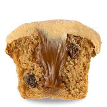 Load image into Gallery viewer, side view of half a La Gloria cupcake with  a dulce de leche core and salted caramel frosting not-bg
