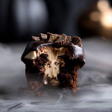 Load image into Gallery viewer, Reese&#39;s®  Peanut Butter Cup cupcake topped and filled with peanut butter frosting and topped with mounds of mini Reese&#39;s® peanut butter cups
