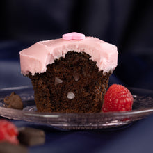 Load image into Gallery viewer, plated raspberry chocolate chip cupcake with chocolate chip studded Belgian dark chocolate cake topped with luscious raspberry frosting
