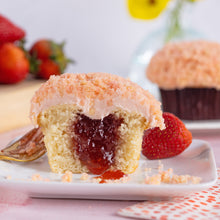 Load image into Gallery viewer, strawberry shortcake bar cupcake on a plate with strawberry jam filling not-bg
