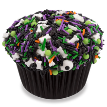 Load image into Gallery viewer, bewitched red velvet cupcake topped with halloween themed Fancy Sprinkles not-bg
