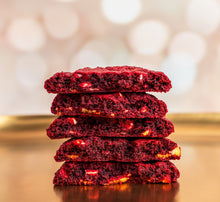 Load image into Gallery viewer, Stack of Sprinkles red velvet cookies.
