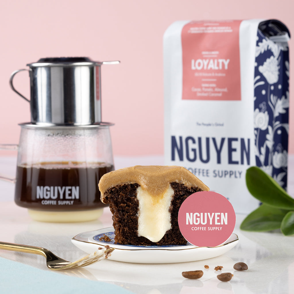 half of a Vietnamese coffee cupcake on a plate with Nguyen Coffee Supply Loyalty blend